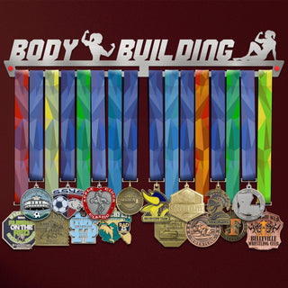 Body Building Medal Hanger Display FEMALE holding colorful medals with a brushed stainless steel finish, ideal for female bodybuilding fans.