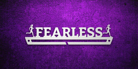 Custom images gallery running medal hanger with 'FEARLESS' text and runner silhouettes, motivational display for athletes.